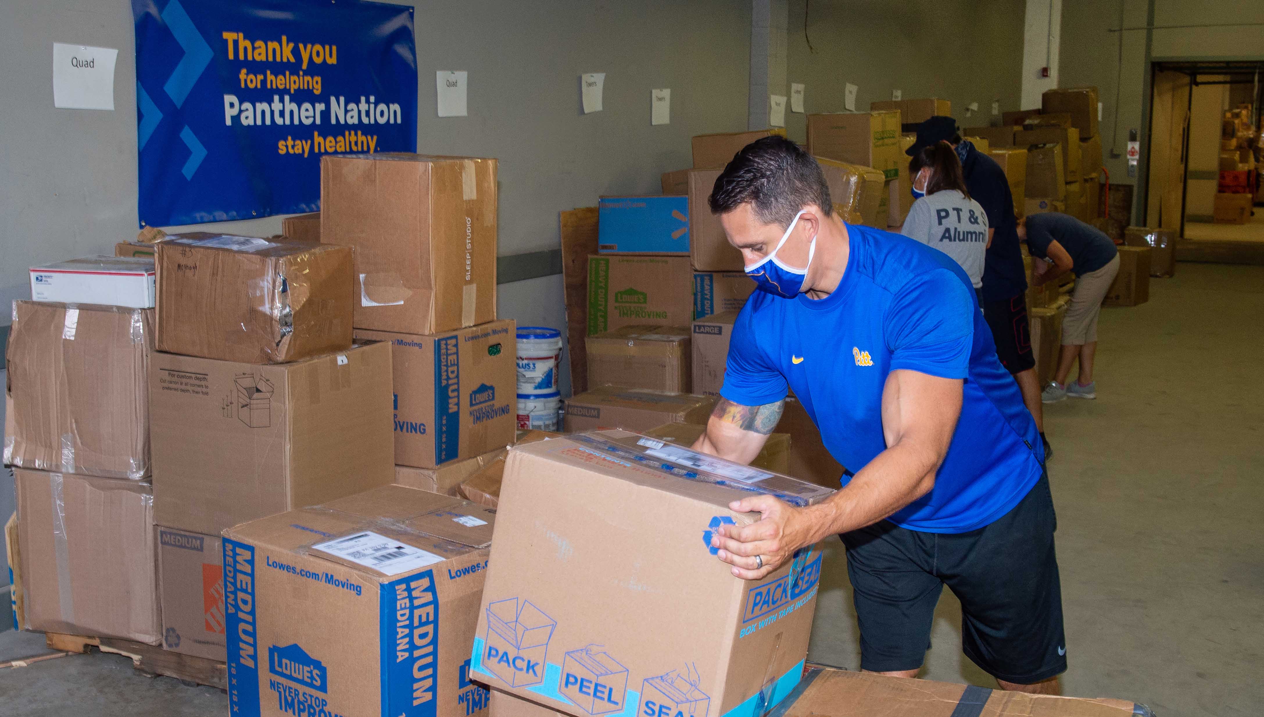 Staff sort through boxes sent to Pitt by students