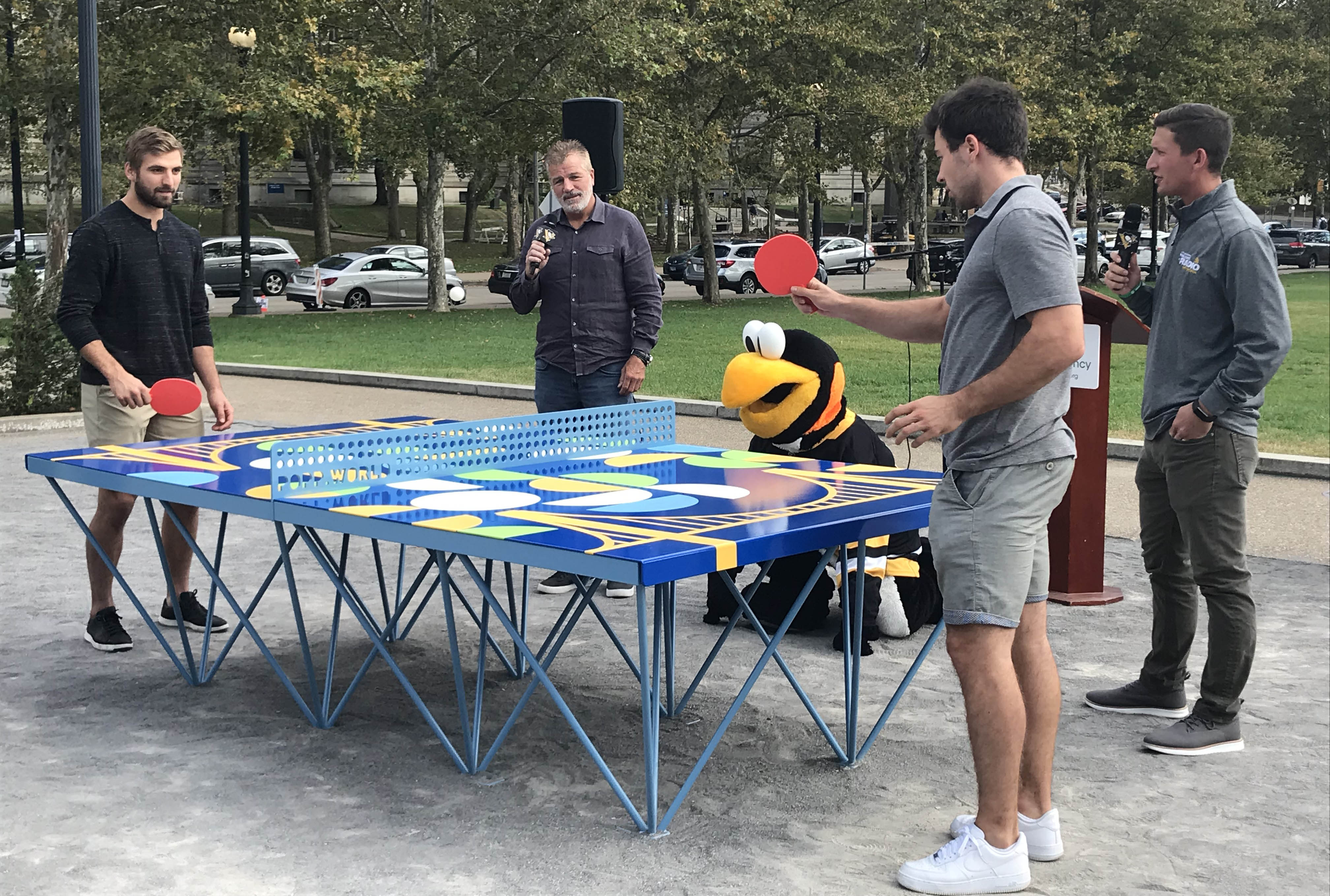 Penguins players at ping pong table