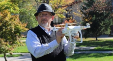 Pitt–Johnstown geography instructor Ahmad Massasati holding drone