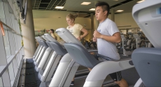 Man and woman on treadmill at Baierl fitness center
