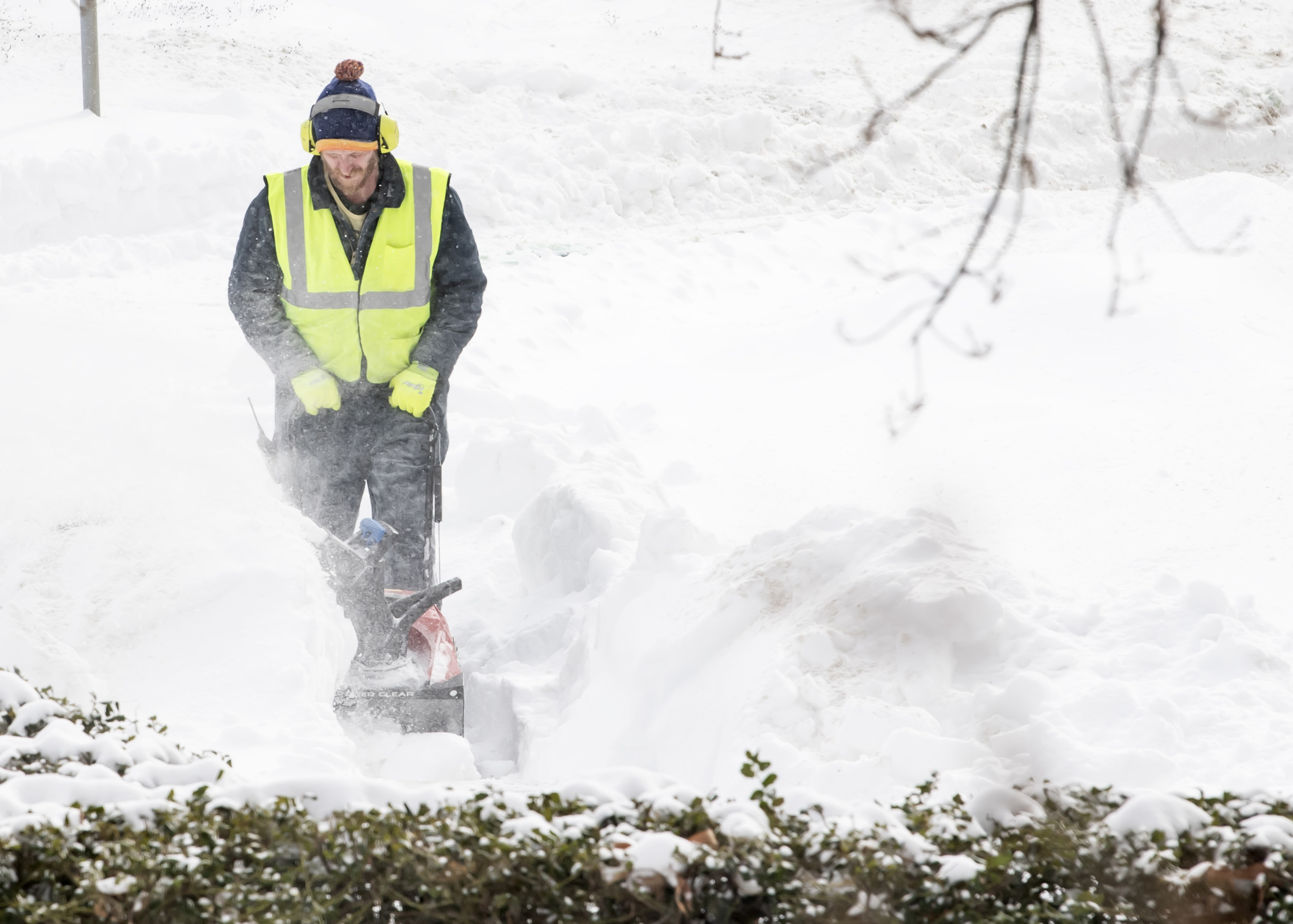 Snow removal crews, which included groundskeepers, custodians and skilled laborers, made several passes on Pitt sidewalks during the winter storm on Jan. 25 and 26. (Photos by Aimee Obidzinski | University of Pittsburgh) Man with snowblower