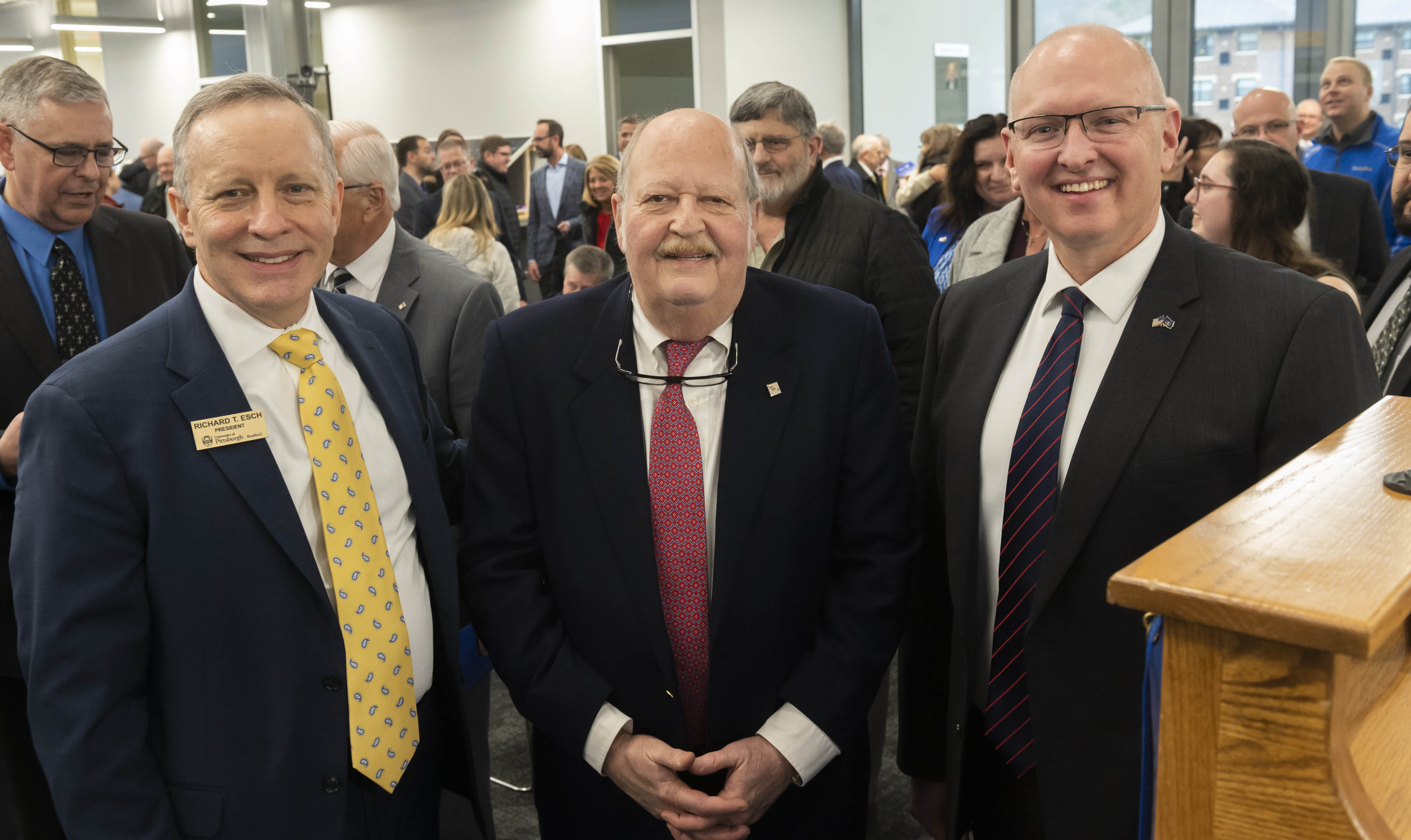 From left, Rick Esch, president of Pitt–Bradford, George B. Duke, owner of Zippo Manufacturing Co., and State Rep. Martin Causer celebrate the dedication of the George B. Duke Engineering and Information Technologies Building at Pitt-Bradford on March 31.