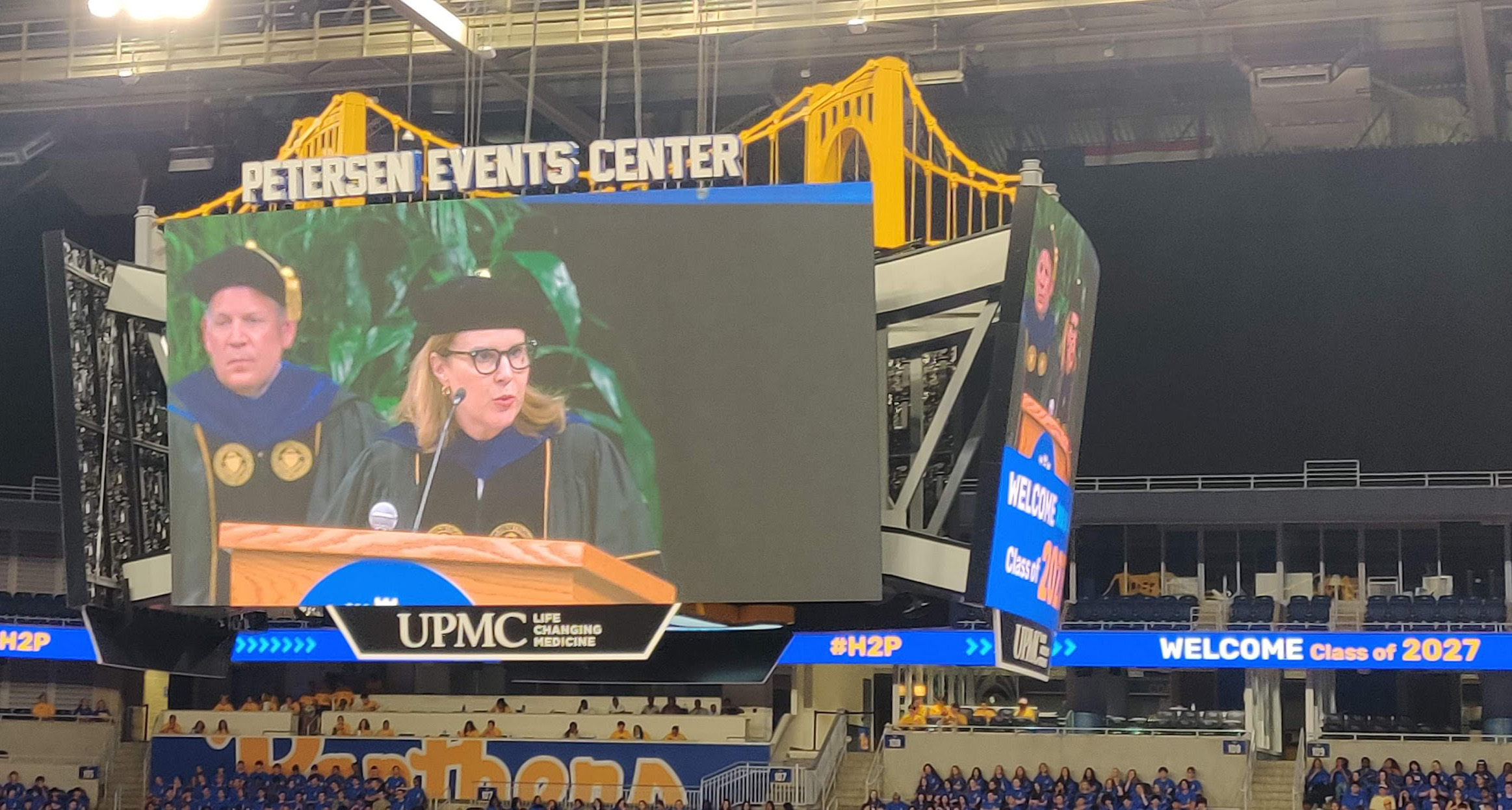 Joan Gabel on screen at student convocation