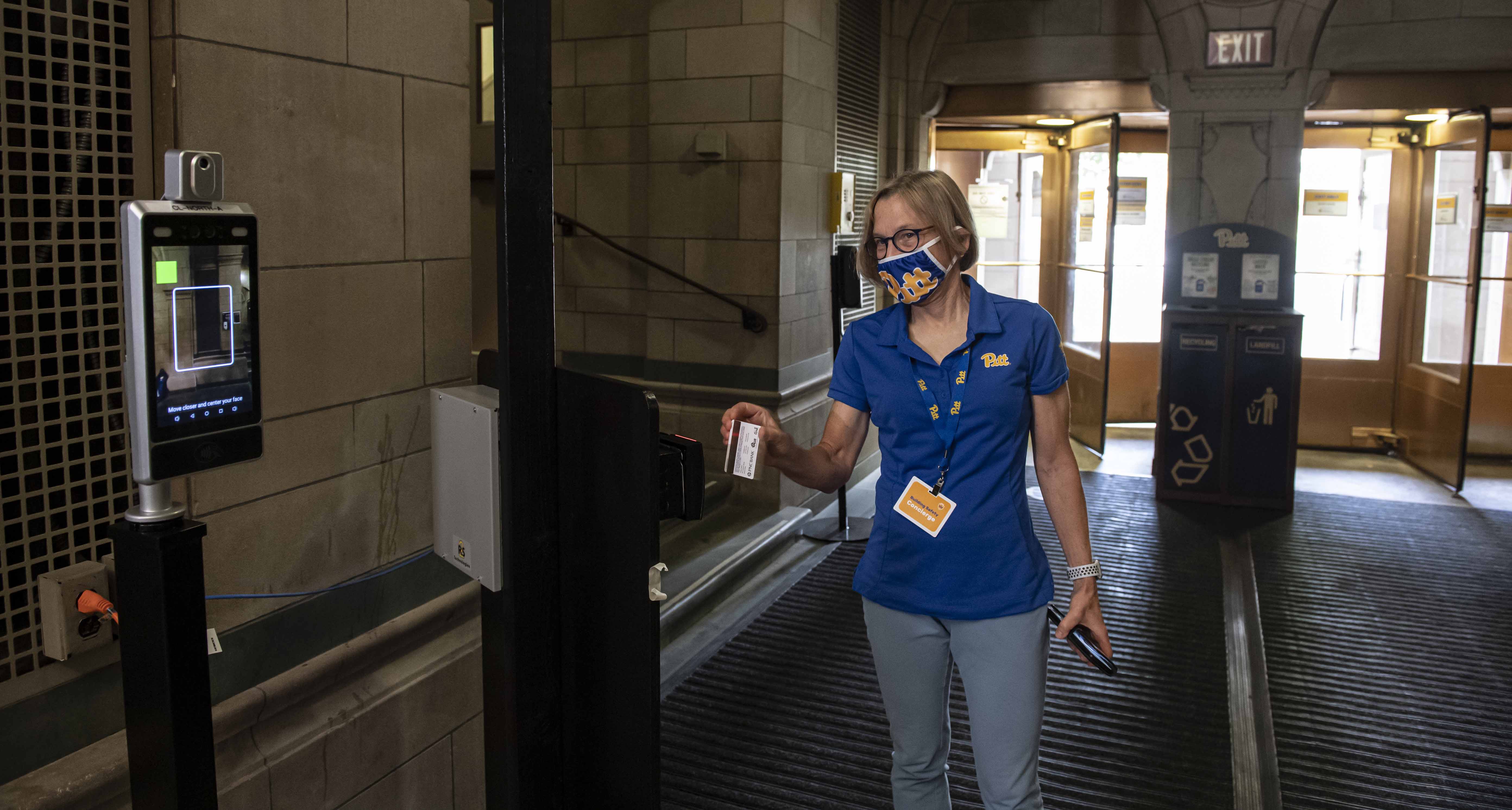 Provost Cudd in mask at Cathedral of Learning