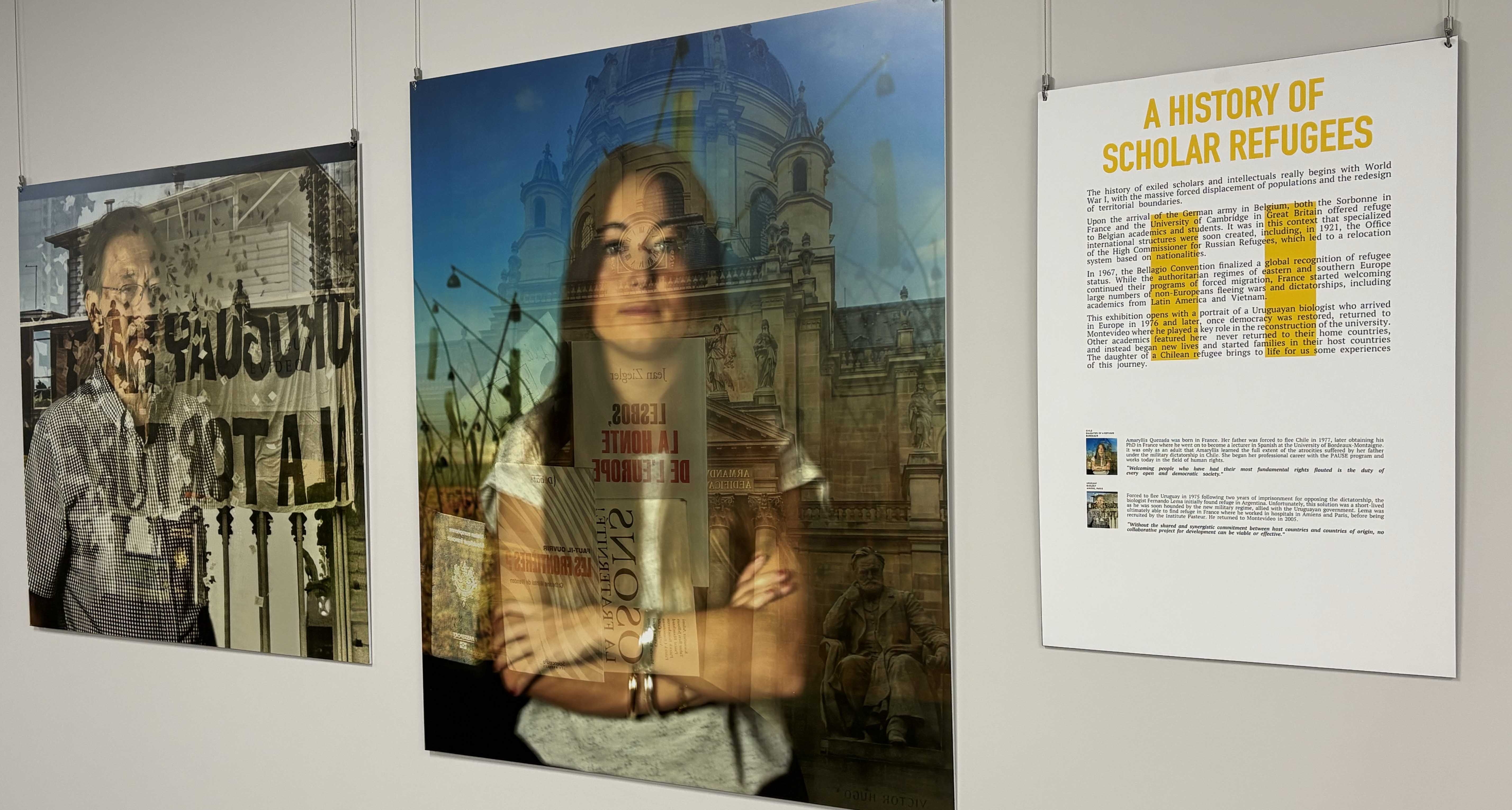 Images of exiled scholars line a hallway on the ground floor of Hillman Library as part of a new exhibit. Two photos and explainer on wall