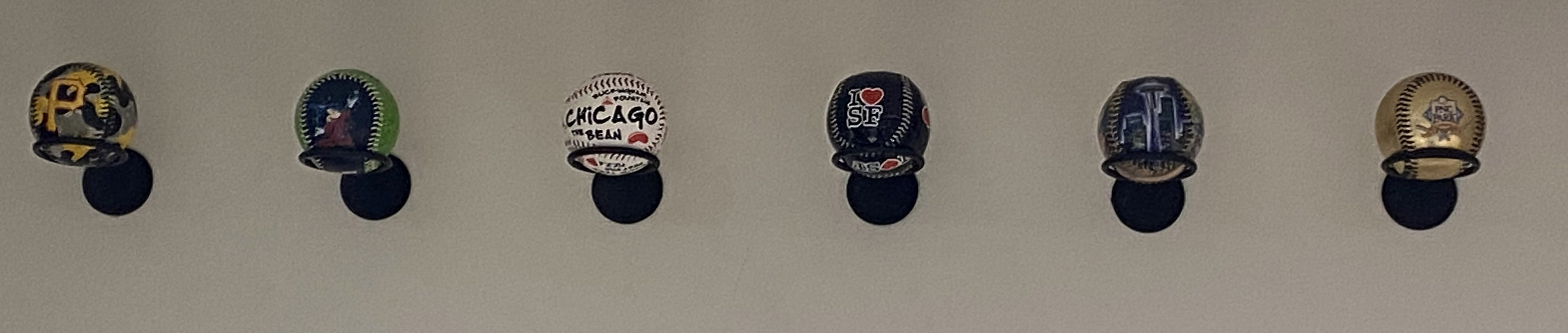 Baseballs displayed on a wall