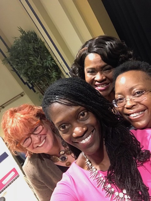 Moderator Valerie Kinloch poses for a selfie with panel members Patricia Beeson, Kathy Humphrey and Geovette Washington.