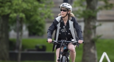 Woman in helmet on bike