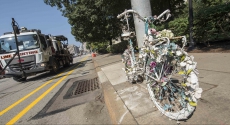 Ghost bike tied to pole on Forbes Avenue