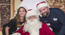 Pitt volunteers and Santa