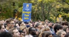 Stronger than hate sign held above sea of people after Tree of Life tragedy