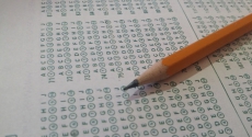 Standardized test answer sheet and pencil