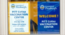 Signs at Pitt vaccination center