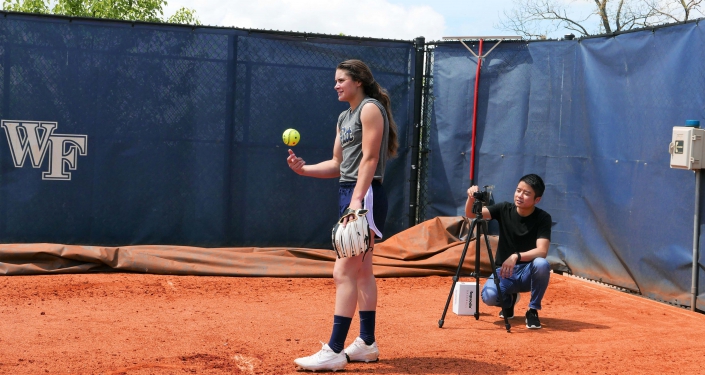 Softball pitcher and tech tracking her throw